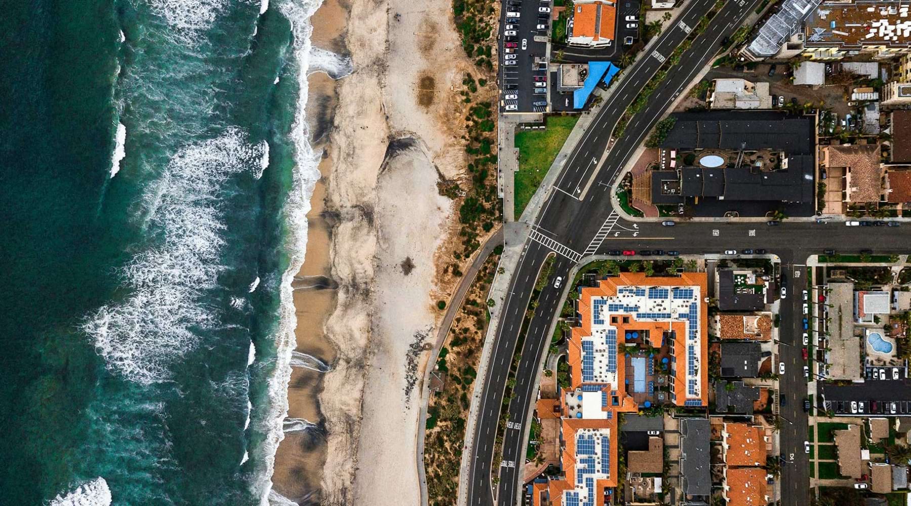 Close to the center of everything aerial view of a city with a city and ocean in view