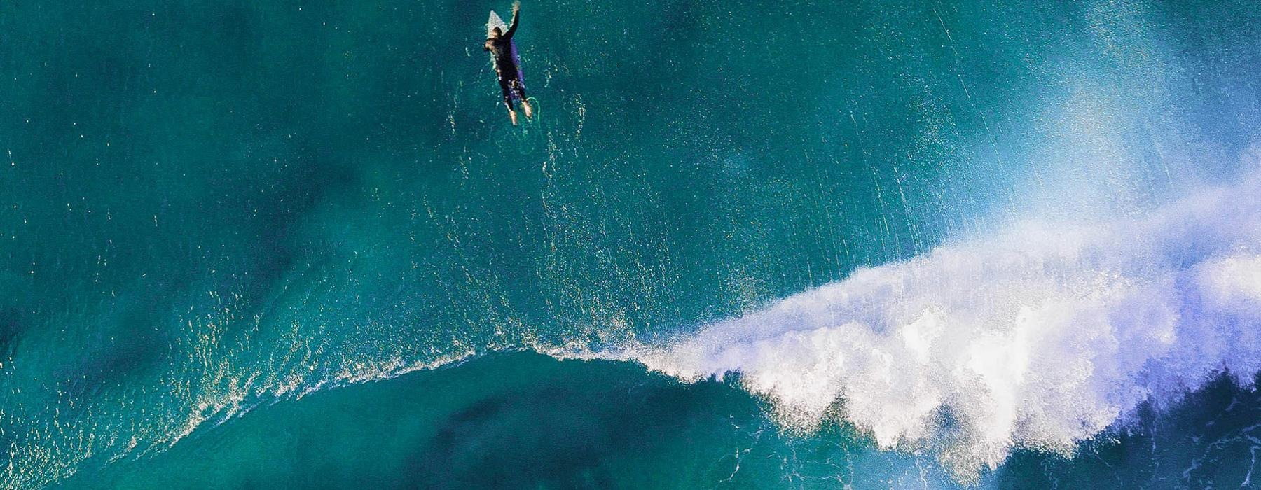 a person surfing on a wave